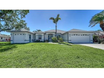 Charming single-story home with a well-manicured lawn and inviting curb appeal at 626 Magellan Dr, Sarasota, FL 34243