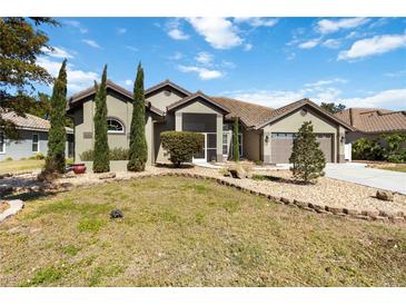Charming home featuring well-maintained landscaping, a two-car garage, and a welcoming entryway at 1118 Deardon Dr, Venice, FL 34292