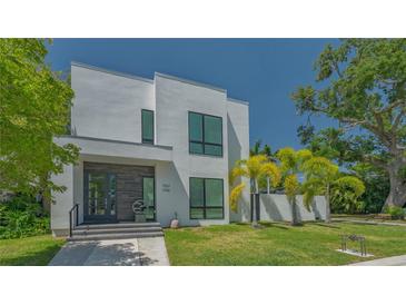 Contemporary two-story home featuring clean lines, modern windows, and well-manicured front lawn at 1755 7Th St, Sarasota, FL 34236