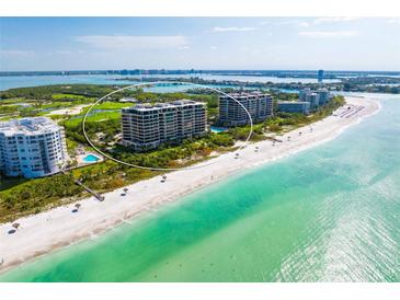 Aerial view of beachfront condos and the Gulf Coast at 435 L Ambiance Dr # H902, Longboat Key, FL 34228