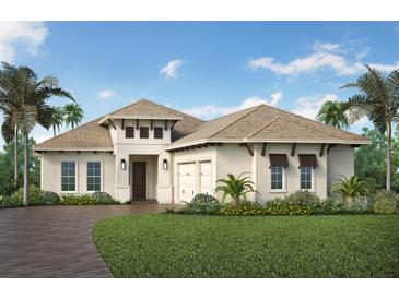 Charming, light beige single-story home featuring a two-car garage, a well-manicured lawn and lush tropical landscaping at 8501 Sandpoint St, Sarasota, FL 34240