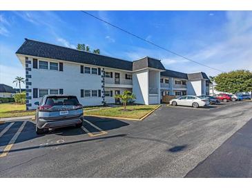 Bright condo complex with black shutters, well-maintained landscaping and ample parking at 204 46Th Avenue W Ter # 412, Bradenton, FL 34207