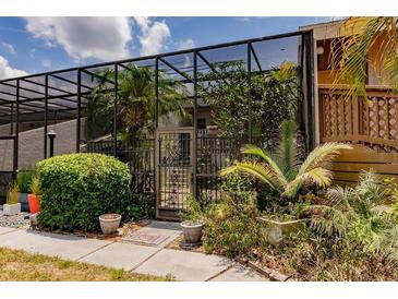 This landscaped patio area is fully screened and has a gate at 323 Bobby Jones Rd # 323, Sarasota, FL 34232