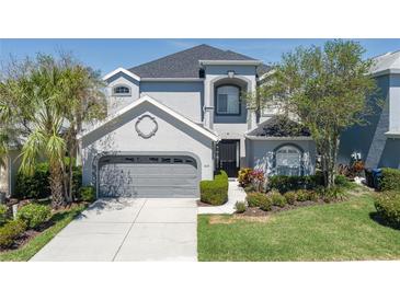Charming two-story home boasts a well-maintained lawn and an attached two-car garage at 6210 Laurel Creek Trl, Ellenton, FL 34222
