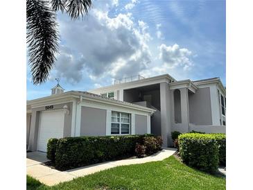 Charming two-story home with landscaped yard and attached garage in a peaceful setting at 5647 Sheffield Greene Cir # 29, Sarasota, FL 34235