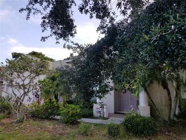 Charming home exterior with lush landscaping and a welcoming front entrance at 1167 Fraser Pine Blvd, Sarasota, FL 34240