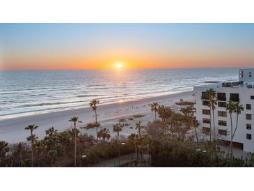 Breathtaking sunrise view over the pristine beach and ocean, a tropical paradise at 1281 Gulf Of Mexico Dr # 704, Longboat Key, FL 34228