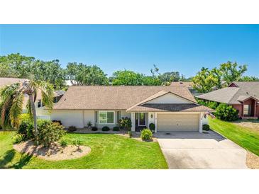 Charming one-story home features a manicured lawn, attached garage and beautiful landscaping at 914 82Nd Nw St, Bradenton, FL 34209