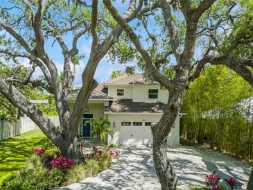 Charming two-story home with well maintained lawn and driveway, complemented by an attached garage at 4013 Red Rock Ln, Sarasota, FL 34231
