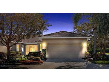 Charming single-story home with a well-manicured lawn and a two-car garage, providing both curb appeal and convenience at 4136 Cascade Falls Dr, Sarasota, FL 34243