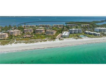 Stunning beachfront condos with crystal-clear turquoise waters and pristine white sand, a tropical paradise at 4760 Gulf Of Mexico Dr. Villa 7, Longboat Key, FL 34228