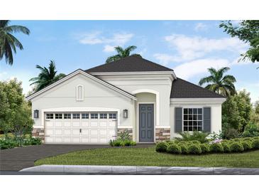 Charming one-story home featuring stone accents, a gray front door, and a lush landscaped yard at 11020 Hogan Cir, Englewood, FL 34223