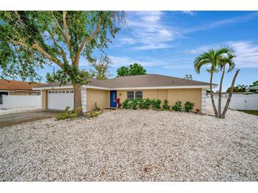 Charming single-story home featuring a well-maintained yard with a two-car garage at 5307 1St Avenue Nw Dr, Bradenton, FL 34209