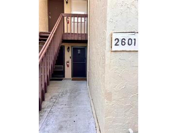 Building entrance with stairs, door B, and unit number 2601 visible at 2601 Pine Lake Ter # B, Sarasota, FL 34237