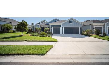 Charming single-story home featuring a two-car garage, well-manicured lawn, and inviting curb appeal at 4308 Fly Rod Ter, Parrish, FL 34219