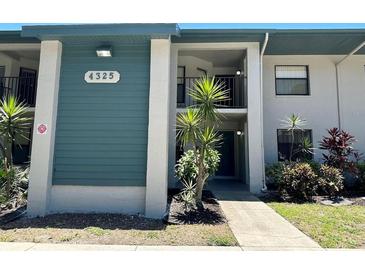 Inviting condo exterior showcases a well-maintained facade, lush landscaping, and a welcoming entrance at 4325 46Th W Ave # 202, Bradenton, FL 34210
