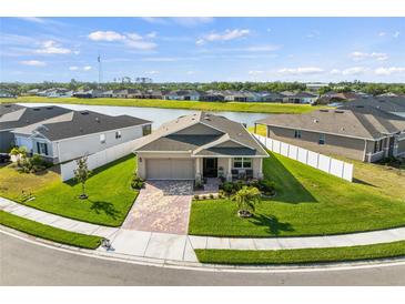Charming single-Gathering home with well-manicured lawn, brick paved drive and stunning pond view at 3478 74Th Avenue E Cir, Sarasota, FL 34243