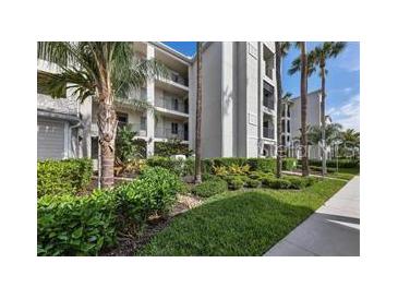 Condos feature lush landscaping, well-maintained grounds, and balconies at 1030 Tidewater Shores Loop # 404, Bradenton, FL 34208
