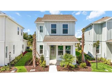 Charming two-story home featuring manicured landscaping, inviting entrance, and a welcoming facade at 172 Eagleston Ln, Sarasota, FL 34240