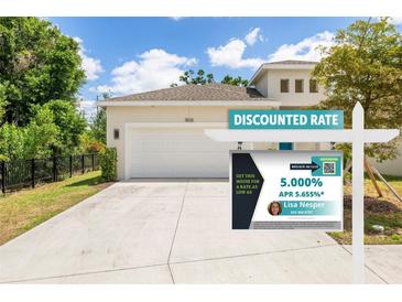 Attractive home featuring an attached garage, and lush landscaping at 1800 Little Bird Ct, Sarasota, FL 34235