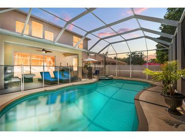 Inviting screened pool area with sun loungers and a built-in hot tub, perfect for relaxation at 5915 43Rd E Ct, Bradenton, FL 34203