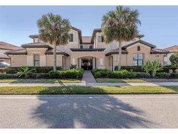Stunning condo with lush landscaping and mature palm trees at 23572 Awabuki Dr # 202, Venice, FL 34293