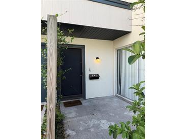 Inviting entryway featuring a well-lit front door and the house number displayed above the mailbox at 940 Byron Ct # 17C, Sarasota, FL 34243