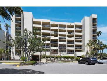 A full view of the condo complex with multi-story residential units, parking and landscaping around the property at 1095 Gulf Of Mexico Dr # 503, Longboat Key, FL 34228