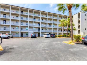 Spacious condominium building featuring multiple floors and resident parking at 3204 Lake Bayshore Dr # 407, Bradenton, FL 34205