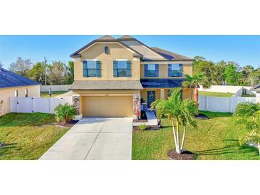 Attractive two-story home featuring a well-manicured lawn and welcoming curb appeal at 4010 Lindever Ln, Palmetto, FL 34221