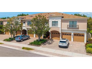 Charming townhomes with attached garages and beautiful brick paver driveways in a well-maintained community at 4225 Overture Cir, Bradenton, FL 34209