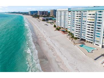 Stunning aerial view of the beachfront condos and pristine white sand beach at 1750 Benjamin Franklin Dr # 6B, Sarasota, FL 34236