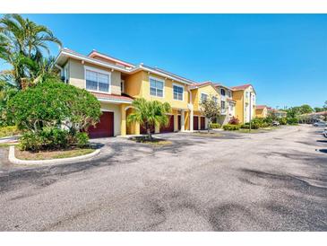 Lovely two-story townhomes with private garage parking and well-maintained landscaping at 5601 Bentgrass Dr # 10-105, Sarasota, FL 34235