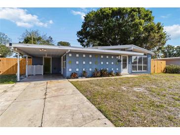 Charming single-story home featuring a covered carport, well-maintained lawn, and inviting curb appeal at 2400 Stanford Ave, Bradenton, FL 34207