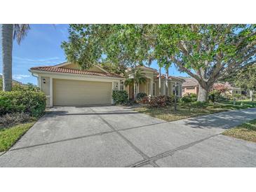 Attractive single-story home boasts a well-manicured lawn, mature landscaping, and inviting curb appeal at 241 Willow Bend Way, Osprey, FL 34229