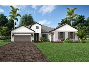 Charming single-story home featuring a brick driveway, lush landscaping, and a welcoming front porch at 11446 Brightly Dr, Venice, FL 34293