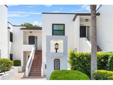 Inviting condo complex with multiple units, well-maintained landscaping, and a clear directory for easy navigation at 5014 Marshfield Rd # 30, Sarasota, FL 34235