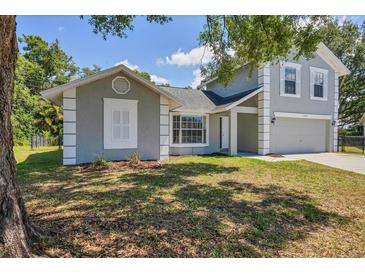 Charming two-story home with a well-maintained lawn and neutral gray paint scheme at 5642 29Th Street E Cir, Bradenton, FL 34203