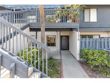 Charming two-story condo with a private entrance, landscaped with lush greenery and a lovely garden view at 7218 Cloister Dr # 7218, Sarasota, FL 34231