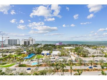 Scenic aerial view of a coastal community featuring parks, buildings, and waterfront vistas at 750 N Tamiami Trl # 1203, Sarasota, FL 34236