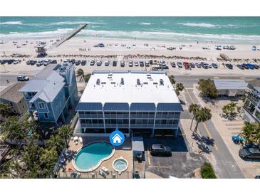 Stunning aerial view of beach condo with private pool, hot tub, and gulf views at 901 Gulf S Dr # 3, Bradenton Beach, FL 34217