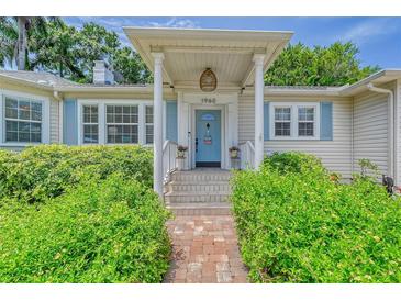 Close up shot of the front porch with stone walkway leading to the front door at 1960 Lincoln Dr, Sarasota, FL 34236