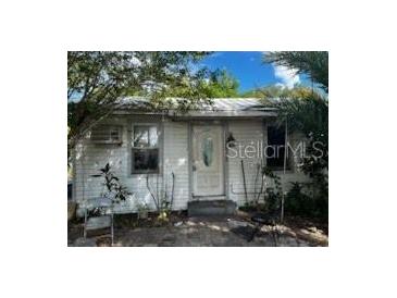 Modest single-story home featuring a white exterior and a simple front entry at 3619 18Th E St, Bradenton, FL 34208