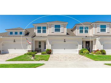 Charming townhome with a well-manicured lawn and a two-car garage for convenient parking and curb appeal at 3684 Fescue Ln, Sarasota, FL 34232