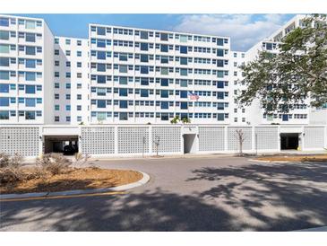 Contemporary condominium building with decorative concrete fencing and covered parking at 33 S Gulfstream Ave # 905, Sarasota, FL 34236
