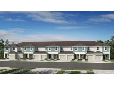 New townhouse community with attached garages and attractive landscaping in a suburban setting at 5897 Biscotti St, Nokomis, FL 34275