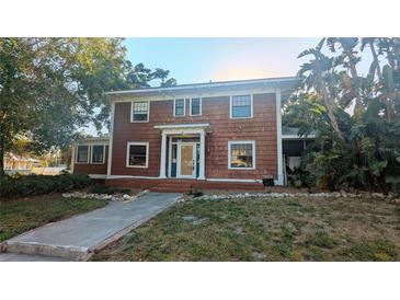 Charming two-story home with mature trees and traditional architecture provides unique curb appeal at 624 19Th W St, Bradenton, FL 34205