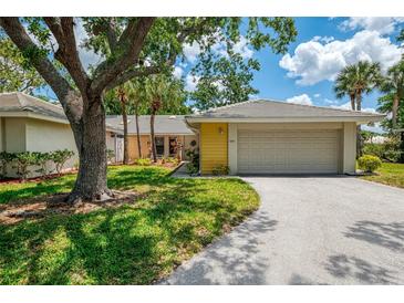 Charming single-story home with a well-manicured lawn and attached two-car garage at 314 Pembroke Ln # 189, Venice, FL 34293