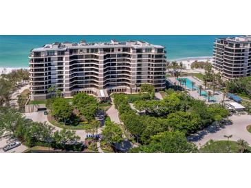 Beautiful high-rise condo with landscaped grounds, a pool, and beach access at 415 L Ambiance Dr # D306, Longboat Key, FL 34228
