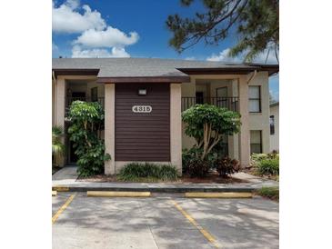Inviting condo exterior features a neutral color scheme and manicured landscaping at 4315 45Th W Ave # 103, Bradenton, FL 34210
